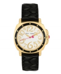 A little old-fashioned and a little over-the-top. Watch by Betsey Johnson crafted of black quilted leather strap and round polished gold tone mixed metal case with black bezel. White dial features whimsical gold tone numerals, gold tone hour and minute hands, pink second hand with heart and logo. Quartz movement. Water resistant to 30 meters. Two-year limited warranty.