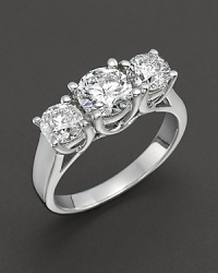 Triple diamond stone ring set in white gold.