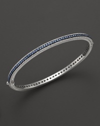 Blue sapphires stud a sterling silver bangle from Judith Ripka.