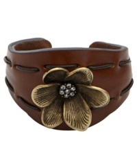 Grace your wrists with sweet florals. A combination of rich moldable leather and a brass tone floral charm with crystal accents create Fossil's stylish cuff bracelet. Tonal stitching. Set in brass tone mixed metal. Approximate diameter: 2-1/2 inches.