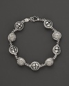 Inspired by Zen philosophy, this intricately detailed sterling silver bracelet from Paul Morelli softly jingles with meditation bells.