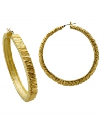 Classic hoop earrings with an added twist. T Tahari's hoop earrings from the Essentials Collection feature a unique textured wrap surface. Crafted in gold tone mixed metal. Base metal is nickel-free for sensitive skin. Approximate diameter: 2 inches.