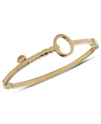 Unlock gorgeous style with this bangle bracelet from Fossil. Designed with a bent key silhouette and hinge. Crafted in gold tone stainless steel. Approximate diameter: 2 5/8 inch.