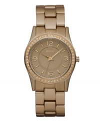 Hints of caramel shine on this mini watch by DKNY. Rose-gold tone aluminum bracelet and round rose-gold aluminum-plated stainless steel case. Bezel embellished with crystal accents. Rose-gold tone dial features applied rose-gold tone numerals at twelve, three, six and nine o'clock, stick indices, minute track, three hands and logo. Quartz movement. Water resistant to 50 meters. Two-year limited warranty.