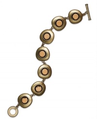 Alluring hues when you need them. Lauren Ralph Lauren's flex bracelet features smoky topaz cabochon stones linked together in antique 14k gold-plated mixed metal. Finished with a toggle closure. Approximate length: 7-1/2 inches.