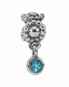 A bezel-set deep blue topaz dangles alluringly from a sterling silver daisy chain. Charm by PANDORA.