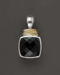 Faceted black spinel is trimmed in sterling silver and accented with yellow gold and diamonds. From Lagos.