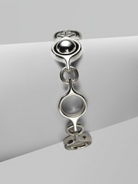 An unique and modern design featuring sterling silver spherical and circular links. Sterling silverToggle closureLength, about 7½Imported 