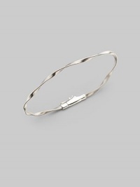 Simply stunning, this 18k gold bangle with delicate ridges and twists is great on its own, even better when stacked in multiples. 18k gold Diameter, about 2½ Tongue-and-groove clasp Imported Please note: Bracelets sold separately.