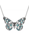 Make a fluttering fashion statement. Fossil's silver tone necklace features a pretty openwork butterfly pendant made of reconstituted turquoise and vintage silver tone mixed metal. Approximate length: 16 inches + 2 inch extender. Approximate drop: 1 inch.