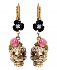 Cuteness to die for, Betsey Johnson does it again. Crystal skulls with heart-shaped eyes and pink flower accents hang from black enamel flowers. Earrings crafted from antique gold-plated mixed metal. Approximate drop: 1-1/2 inches.