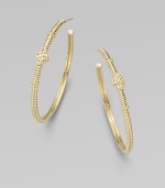 From the Jolie Collection. Elegantly fluted gold hoops, accented with gold beading and quatrefoil shapes set with sparkling diamonds.Diamonds, .12 tcw14k yellow goldDiameter, about 1½Post backImported