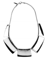 Status symbol. This not-so-subtle style will get you recognized fast. Shiny geometric pieces make up Nine West's chic collar necklace. Crafted in silver tone mixed metal. Approximate length: 16 inches + 2-inch extender. Approximate drop: 1 inch.