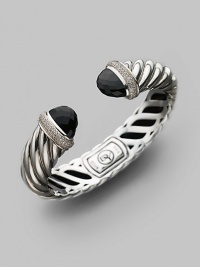 From the Waverly Collection. Sculpted cable design of sterling silver with pavé diamonds and black onyx tips. Diamonds, 0.76 tcw Diameter, about 2¼ Width, about 1¾ Hinge close Imported