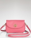 Prim and petite, this leather Tory Burch crossbody is a must for any polished look, detailed with an understated emblem. Its lined interior features two compartments and an open pocket.