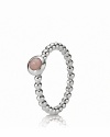 A sterling silver beaded band perfectly complements a bezel-set pink opal cabochon. Wear this striking ring on its own, or stacked with other PANDORA pieces for a signature statement.