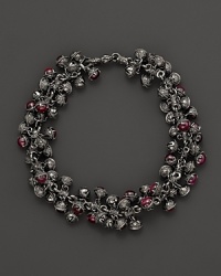 Inspired by Zen philosophy, this intricately detailed sterling silver bracelet from Paul Morelli softly jingles with meditation bells and cabochons of pink rhodalite.