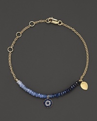 Adorn yourself with sparkling diamonds and rough-cut sapphire briolettes set in a 14K yellow gold bracelet inspired by ancient traditions.