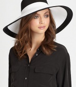 A colorblocked design adds a stylish touch to this dramatic, lightweight topper with elasticized inner band and an oversized brim for maximum sun protection.Brim, about 6.5Elasticized inner band fits most95% UVA/UVB protectionPolypropylene/rayon/polyesterSpot cleanImported and hand-finished in the USA