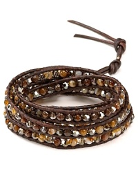 Simple yet eclectic. This Chan Luu leather wrap bracelet refines bohemian style with its mix of semi-precious gemstones and striking Swarovski crystals.