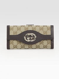 Signature jacquard with rich logo-stamped Guccissima leather trim in a classic continental silhouette, finished with polished GG hardware.Flap and snap closureOutside snap coin pocket Two inner bill compartmentsSeven credit card slotsLeather lining7½W X 3½H X 1DMade in Italy