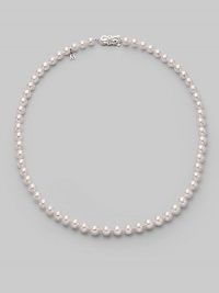 From the Akoya collection. A classic strand of white Akoya pearls with a pretty filigree clasp. 6.5mm white round cultured pearls Quality: A1 18k white gold Length, about 18 Mikimoto signature clasp Imported