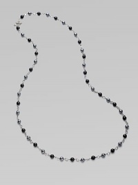 From the Bijoux Collection. A long elegant sterling silver strand of black onyx and hematite beads.Black onyx, hematite Sterling silver Length, about 40 Toggle closure Imported