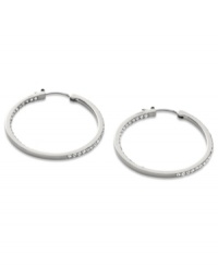 Go full-blitz with these glitzy hoop earrings from Fossil. The classic design is amped up with clear pave crystal accents. Crafted in polished stainless steel. Approximate diameter: 1-3/8 inches.