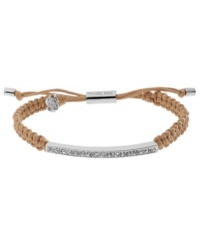 A natural wonder. Michael Kors' chic macrame bracelet features woven natural-tone cotton cord with a silver tone mixed metal bar, accented with glistening pave glass stones. Clasp and logo charms crafted in silver tone mixed metal. Approximate diameter: 2 to 2-3/4 inches. Bracelet adjusts to fit wrist.