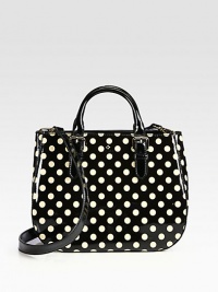 A versatile shape in glossy patent leather is freshened with vintage-inspired polka dots. Detachable shoulder strap, 20½ dropDouble adjustable top handles, 3¼-5 dropMagnetic snap closureOne inside zip pocketTwo inside open pocketsCotton lining13W X 10H X 5DImported