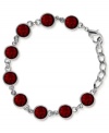 Crimson couture. This bracelet from 2028 is crafted from silver-tone mixed metal and stuns with red stones to liven up the links. Approximate length: 7 inches. Approximate height: 1/3 inch.