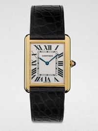 From the Tank Collection. A radiant 18k gold timepiece that combines the past with the present, making it quintessentially Cartier. Quartz movementWater resistant to 3 ATMRectangular 18k gold case, 34.8mm (1.4) X 27.4mm (1)Smooth bezelPale silver opaline dialRoman numeral hour markersAlligator strap with 18k gold buckleMade in Switzerland 