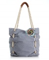 Sweet stripes and a fabulous floral embellishment give this American Rag bag the perfect warm weather look. Woven rope straps add a nautical touch to this oh-so adorable design.