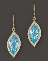 Pavé diamonds frame faceted blue topaz, set in 18K gold leaves. By Carelle.