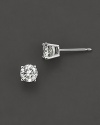 Classic diamond stud earrings sparkle, elegantly set in 14K white gold.