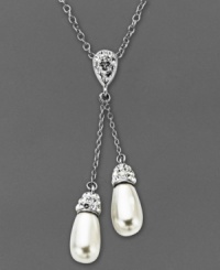 Twice the elegance. Two polished crystal teardrops adorn Kaleidoscope's stunning lariat pendant necklace. Crafted in sterling silver with Swarovski Elements. Approximate length: 18 inches. Approximate drop: 1-9/10 inches.