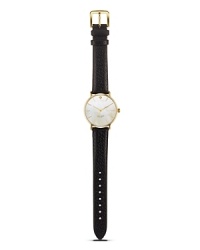 Take a classic approach to accessorizing with this leather strap watch from kate spade new york. With a gold-plated case and Mother-of-Pear dial, it's a timeless choice.