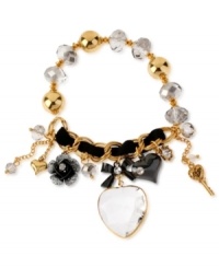 Make a heartfelt statement about your personal style. This half-stretch bracelet from Betsey Johnoson is crafted from gold-tone mixed metal with an intertwined black grosgrain ribbon and multi-tone charms and beads. A glass crystal heart is the center of attraction. Approximate length: 7-1/2 inches.