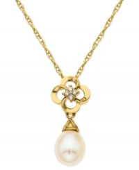 Make a stunning statement. This pendant, crafted from 10k gold, features a beautiful cultured freshwater pearl (8-10 mm) and diamond accents for a sparkling touch. Approximate length: 18 inches. Approximate drop: 9/10 inch.