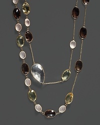 A mix of colorful quartz and clear crystal stations on a 14K yellow gold chain.