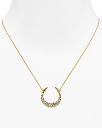 Catch good luck in this glittering 18 Kt. gold plate horseshoe, encrusted with starry Swarovski crystals. By Alexis Bittar.