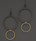 Striking, elegant hoops of black and yellow gold. By Lana.