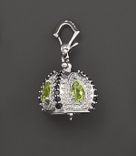 Inspired by Zen philosophy, this polished sterling silver Raja meditation bell from Paul Morelli is set with peridot and black spinel.