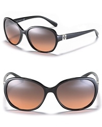 Glam it up in Tory Burch's round oversized sunglasses with a subtle signature logo at temples.