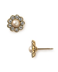 Channel your inner lady who luxes in kate spade new york's gold-plated pearl earrings. During the day, these delicate studs go to lunch with a boucle suit and structured handbag.