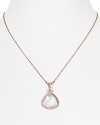 You'll turn heads in this Coralia Leets stunning pendant necklace. With a pink teardrop pendant and breast cancer logo, this design inspires as much as it shines.