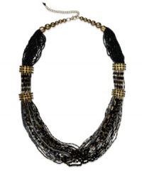 Change the tone of your evening with this moody statement necklace from Style&co. Multiple strands are embellished with black plastic beads with stations accented with glass details. Crafted in gold tone mixed metal. Approximate length: 29 inches + 3-inch extender.