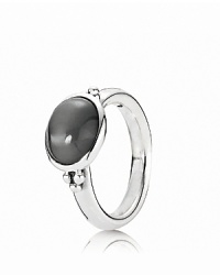 A striking grey moonstone makes a bold statement in a sterling silver bezel setting. Ring by PANDORA.