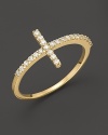 A slim, elegant 14K yellow gold cross ring set with faceted diamonds. By Meira T.