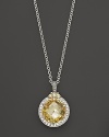 White sapphires frame a sparkling canary crystal on this Judith Ripka pendant necklace.